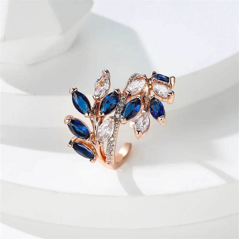 Adjustable ring with blue crystals and refined leaf motif